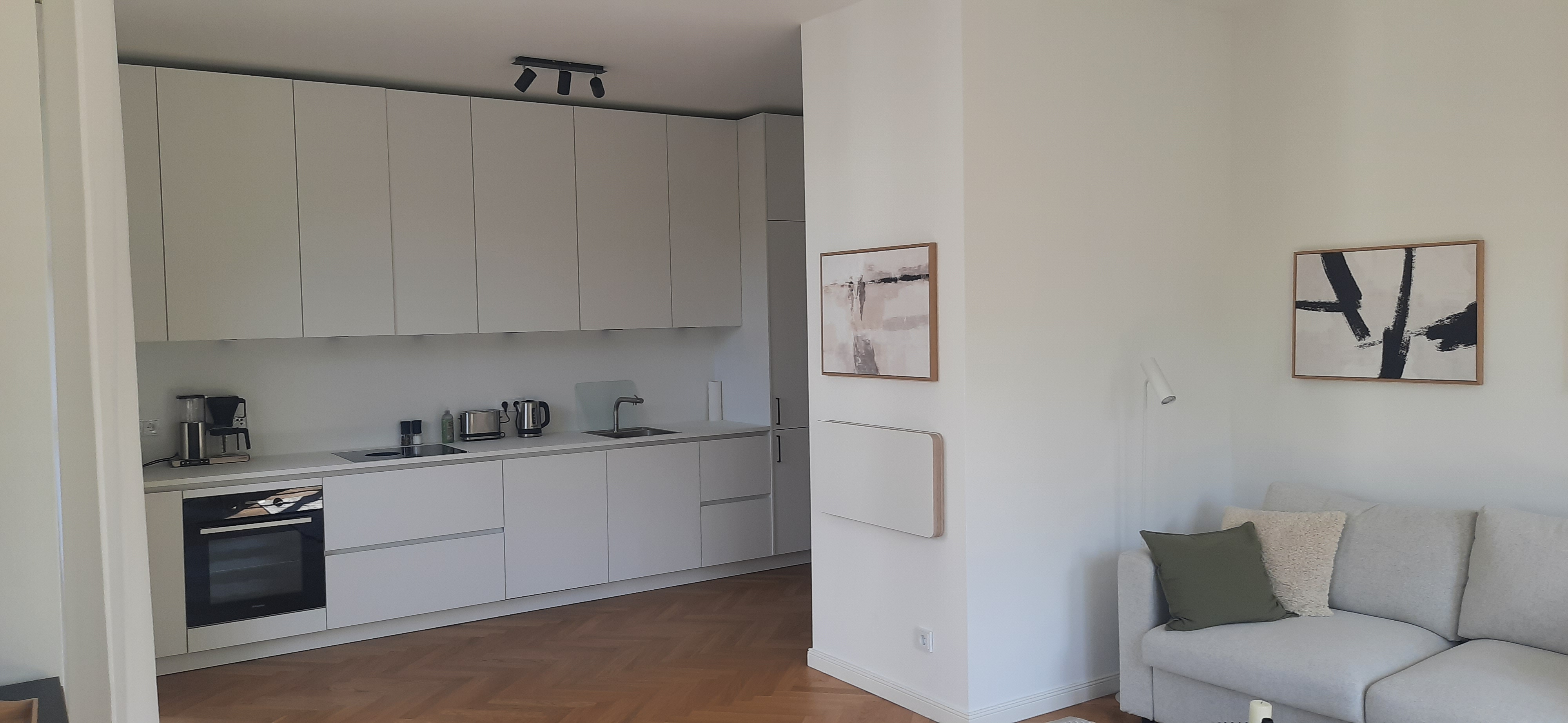 Modern white designer kitchen with premium appliances